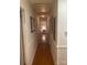 Hallway view leading to a bedroom, showcasing the home's layout and hardwood flooring at 903 Woodside Dr, Kings Mountain, NC 28086