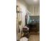 A simple laundry room with front-loading washer/dryer and overhead storage at 903 Woodside Dr, Kings Mountain, NC 28086