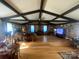 Spacious living room features a wood-burning stove, exposed beams, and beautiful hardwood floors at 903 Woodside Dr, Kings Mountain, NC 28086