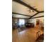 The open living room features hardwood floors, a brick accent wall, and elegant wood beams at 903 Woodside Dr, Kings Mountain, NC 28086