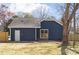 Backyard featuring a blue home with fenced yard and patio at 9930 Sardis Oaks Rd, Charlotte, NC 28270