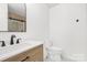 Clean bathroom with modern vanity, lighting, hardware and minimalist design at 9930 Sardis Oaks Rd, Charlotte, NC 28270