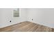 Bright and airy bedroom with wood floors, neutral paint, and natural light at 9930 Sardis Oaks Rd, Charlotte, NC 28270