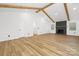 Bright living room with hardwood floors, fireplace, and exposed wood beams at 9930 Sardis Oaks Rd, Charlotte, NC 28270
