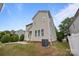 Home's backyard and side exterior showing the patio and air conditioning unit at 10349 Alvarado Way, Charlotte, NC 28277