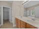 Bathroom features double vanity, large mirror, and walk-in shower with glass enclosure at 10349 Alvarado Way, Charlotte, NC 28277