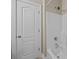 Bright white shower and tub combination with sleek white door at 10349 Alvarado Way, Charlotte, NC 28277