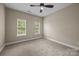Cozy bedroom with natural light, neutral paint, and a ceiling fan at 10349 Alvarado Way, Charlotte, NC 28277
