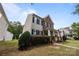 Charming two-story home with brick and siding, dark shutters, well-manicured lawn, and inviting front porch at 10349 Alvarado Way, Charlotte, NC 28277