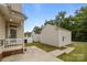 View of detached garages, each matching the house's style, adding extra storage at 10349 Alvarado Way, Charlotte, NC 28277