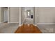 Spacious living room with hardwood floors, neutral paint, and connecting hallways for easy access at 10349 Alvarado Way, Charlotte, NC 28277
