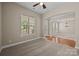 Cozy living room with neutral carpeting, large window, and plenty of natural light at 10349 Alvarado Way, Charlotte, NC 28277