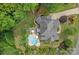 Stunning aerial view of home with a backyard pool, patio, and lush landscaping at 109 Walking Horse Trl, Davidson, NC 28036