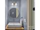 Stylish powder room with a vessel sink, gold framed mirror, and modern fixtures at 109 Walking Horse Trl, Davidson, NC 28036