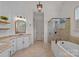 Elegant primary bathroom with soaking tub, walk-in shower, and granite countertops at 109 Walking Horse Trl, Davidson, NC 28036