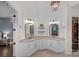 Bathroom with double vanities, granite counters, and shiplap accent wall at 109 Walking Horse Trl, Davidson, NC 28036
