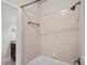 Well-lit bathroom features a tiled shower/tub combination with bronze fixtures and a granite-topped vanity at 109 Walking Horse Trl, Davidson, NC 28036