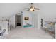 Bright bonus room featuring neutral carpet, ceiling fan, and playfully decorated walls, perfect for a playroom at 109 Walking Horse Trl, Davidson, NC 28036