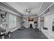 Home gym with fitness equipment, recessed lighting, a ceiling fan and a wall-mounted television for entertainment at 109 Walking Horse Trl, Davidson, NC 28036