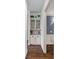 Stylish hallway featuring hardwood flooring, built-in cabinets, and elegant decor at 109 Walking Horse Trl, Davidson, NC 28036