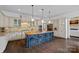 Spacious kitchen with large island with seating, modern appliances, and stone backsplash at 109 Walking Horse Trl, Davidson, NC 28036