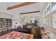 Open-concept living room showcasing a kitchen, stone fireplace, and hardwood floors at 109 Walking Horse Trl, Davidson, NC 28036