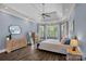 Spacious main bedroom with a tray ceiling, plenty of natural light, and neutral decor at 109 Walking Horse Trl, Davidson, NC 28036