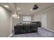 Home movie room includes a projector, screen, cozy seating, and ambient lighting for an immersive viewing experience at 109 Walking Horse Trl, Davidson, NC 28036