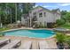 A stunning pool with an attached spa and outdoor kitchen, perfect for luxurious relaxation and entertaining at 109 Walking Horse Trl, Davidson, NC 28036