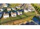 View of the backyard and surrounding neighborhood, a pond runs nearby at 112 Aspire Cir, Wingate, NC 28174