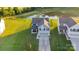 Aerial view of a well-maintained home featuring a long driveway and manicured lawn at 112 Aspire Cir, Wingate, NC 28174