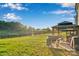 Lush backyard with gazebo and grilling area offering serene outdoor space near a pond at 112 Aspire Cir, Wingate, NC 28174