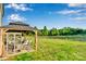 Spacious backyard featuring a gazebo-covered patio and lush green lawn, ideal for outdoor enjoyment at 112 Aspire Cir, Wingate, NC 28174