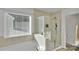 Bathroom featuring tiled shower, soaking tub, and large window at 112 Aspire Cir, Wingate, NC 28174