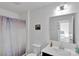 Bright bathroom featuring a white vanity, decorative shower curtain, and a large mirror at 112 Aspire Cir, Wingate, NC 28174