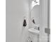 Clean bathroom with a pedestal sink, oval mirror, and modern fixtures at 112 Aspire Cir, Wingate, NC 28174