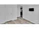 Bedroom with wood-look floors and a mounted TV for a cozy and modern feel at 112 Aspire Cir, Wingate, NC 28174