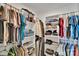 Organized walk-in closet with shelving and hanging racks at 112 Aspire Cir, Wingate, NC 28174