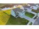 Two-story home with a well-maintained lawn, a pond view, and a two-car garage at 112 Aspire Cir, Wingate, NC 28174