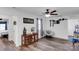 Alternative living room view featuring wood-look floors, cabinet, and a unique papasan chair at 112 Aspire Cir, Wingate, NC 28174
