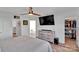 Cozy main bedroom with a ceiling fan, TV, dresser, closet, and attached bathroom at 112 Aspire Cir, Wingate, NC 28174