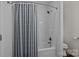 Clean bathroom featuring a shower-tub combination with grey curtain at 113 Ervin St, Belmont, NC 28012