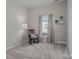 Cozy bedroom with neutral tones featuring chair and reading shelves at 113 Ervin St, Belmont, NC 28012