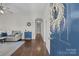 Welcoming entryway featuring hardwood floors, a blue accent cabinet, and neutral paint at 113 Ervin St, Belmont, NC 28012