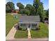 Charming front exterior with a landscaped yard and inviting front porch at 113 Ervin St, Belmont, NC 28012