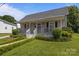 Quaint single-story home with a welcoming front porch and well-maintained landscaping at 113 Ervin St, Belmont, NC 28012