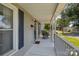Relaxing front porch with black rocking chairs, white railings, and classic design at 113 Ervin St, Belmont, NC 28012