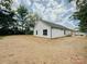 Newly sodded backyard of a charming white home at 118 3Rd Nw Ave, Conover, NC 28613