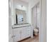 Bathroom with granite vanity, mirror, lighting and doorway to shower and toilet at 118 3Rd Nw Ave, Conover, NC 28613