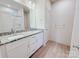 Bathroom features a double sink granite-topped vanity, a large mirror, and recessed lighting at 118 3Rd Nw Ave, Conover, NC 28613